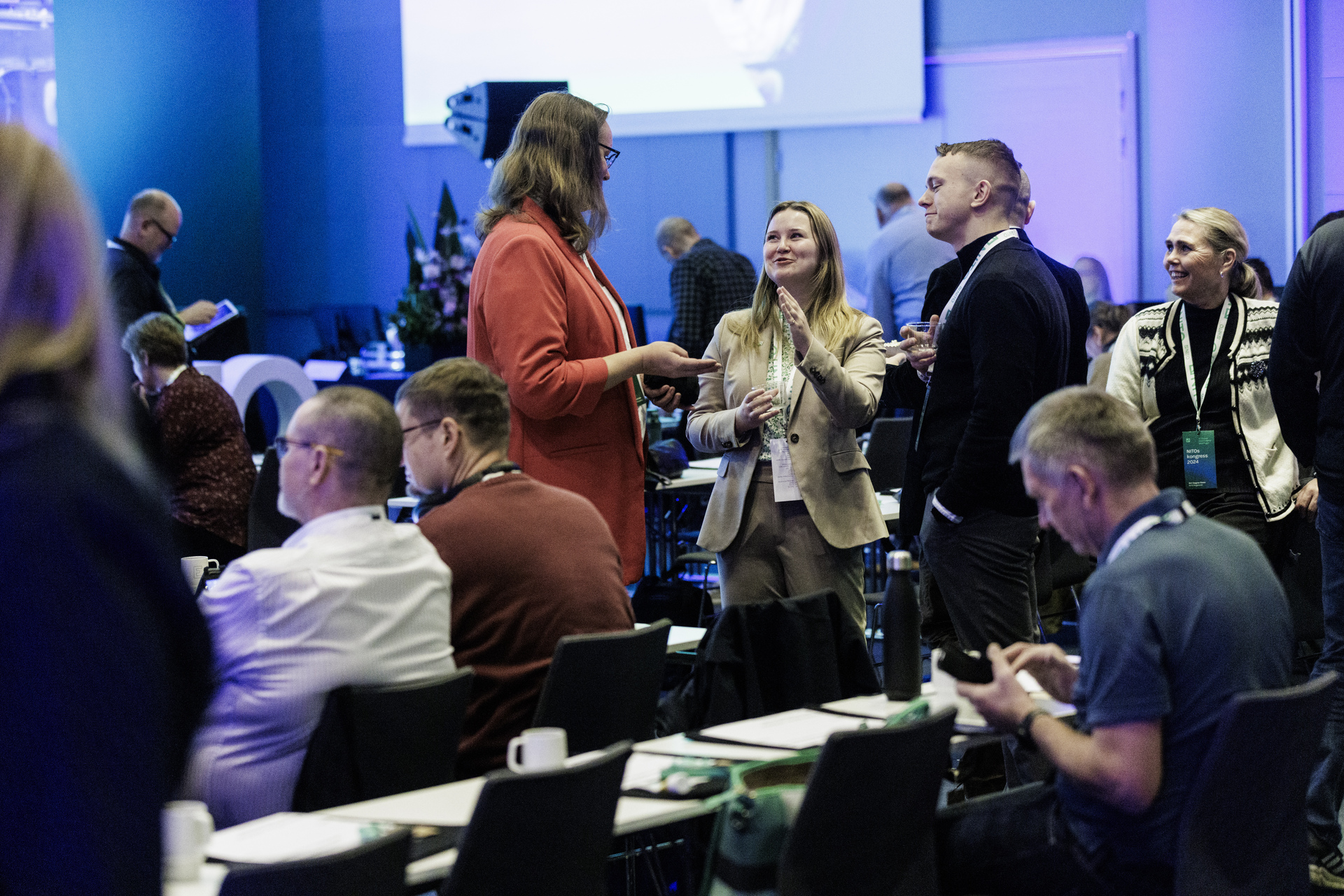 NITO union representatives stand and discuss in the congress hall 2024